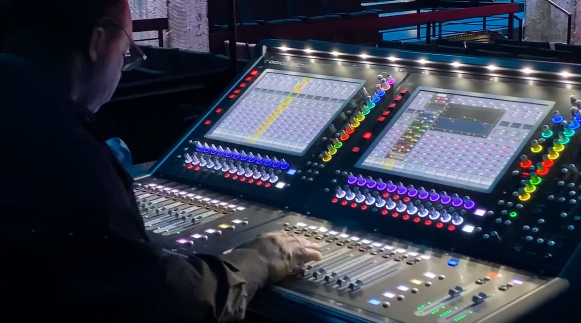 Engineer mixing on a DiGiCo digital console at front of house