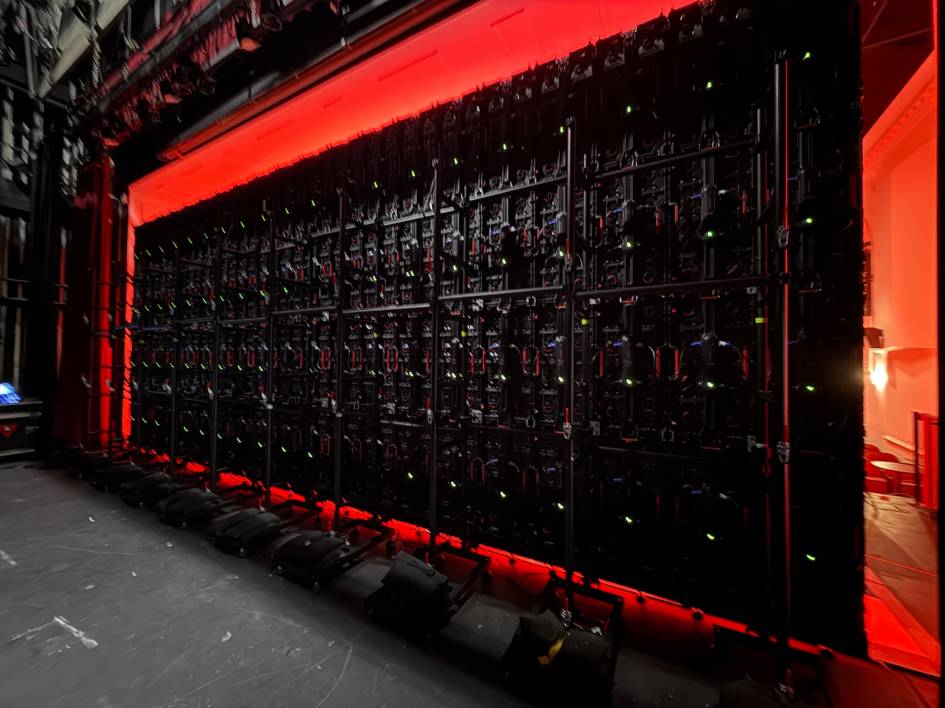 LED video wall panels assembled on stage with red backlighting